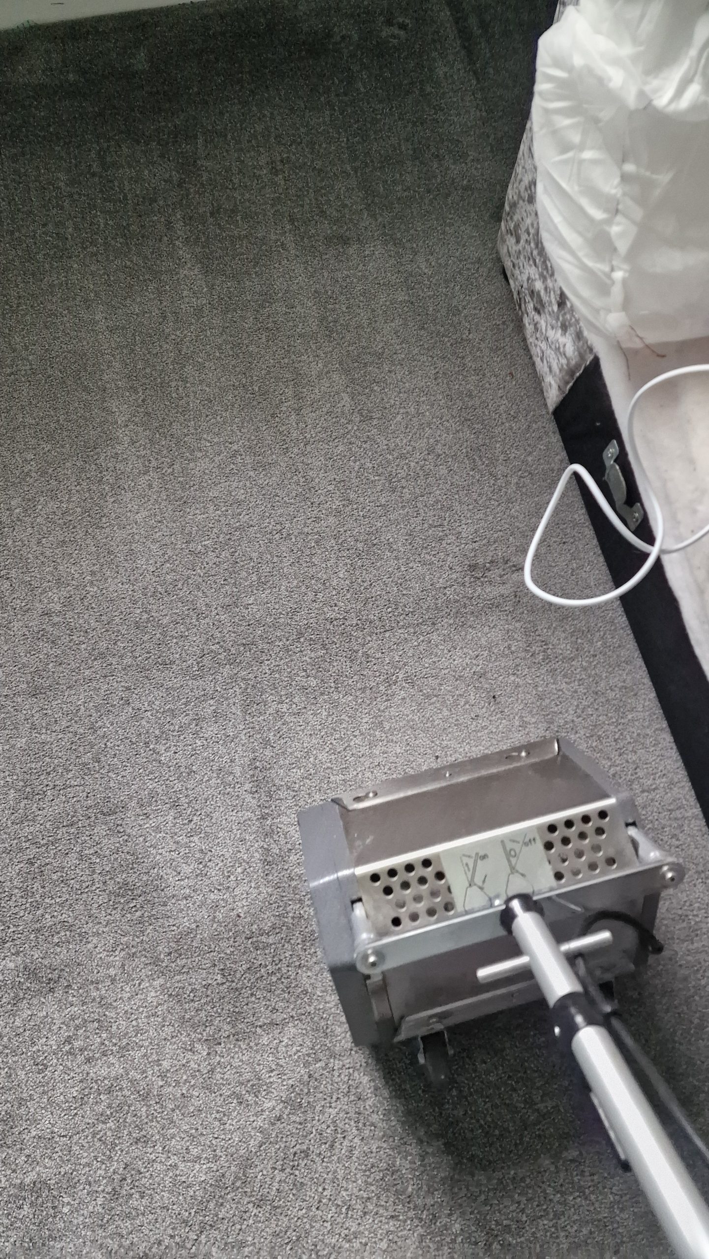 Applying pre-spray wuth TM3 machine for professional carpet cleaning