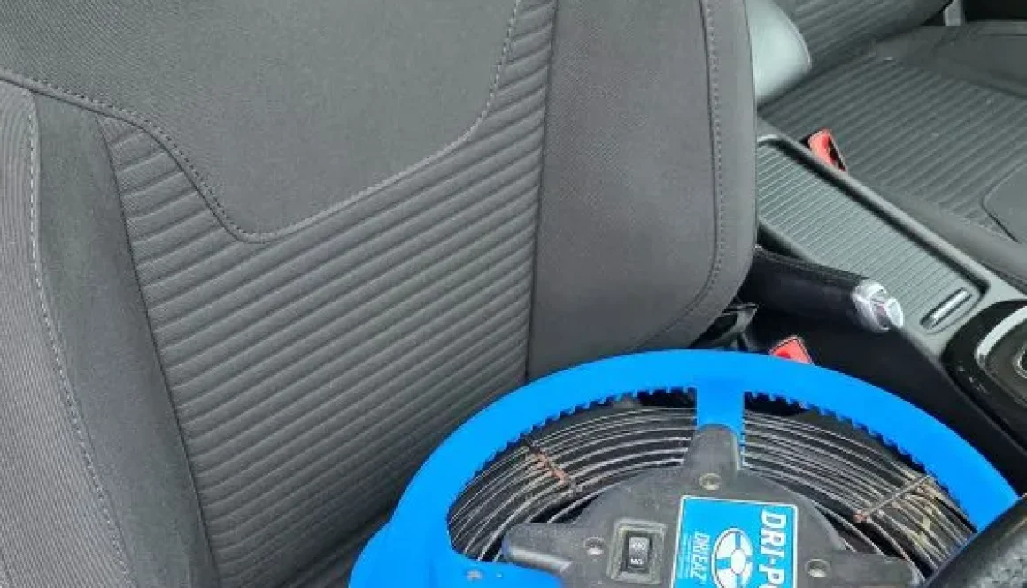 Professional car seat drying in Ely using a Dri-Pod air mover after deep upholstery cleaning.