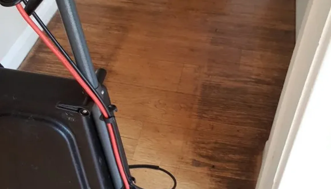 Hard floor in Ely before cleaning, showing Truvox machine and dirt buildup.