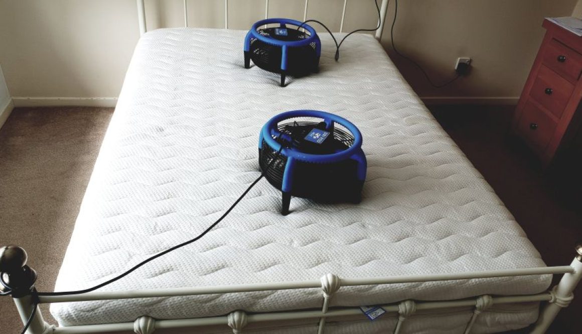 Professional mattress cleaning in Ely by Ely Cleaning Services using two Dri-Pod air movers for rapid drying after deep steam extraction.