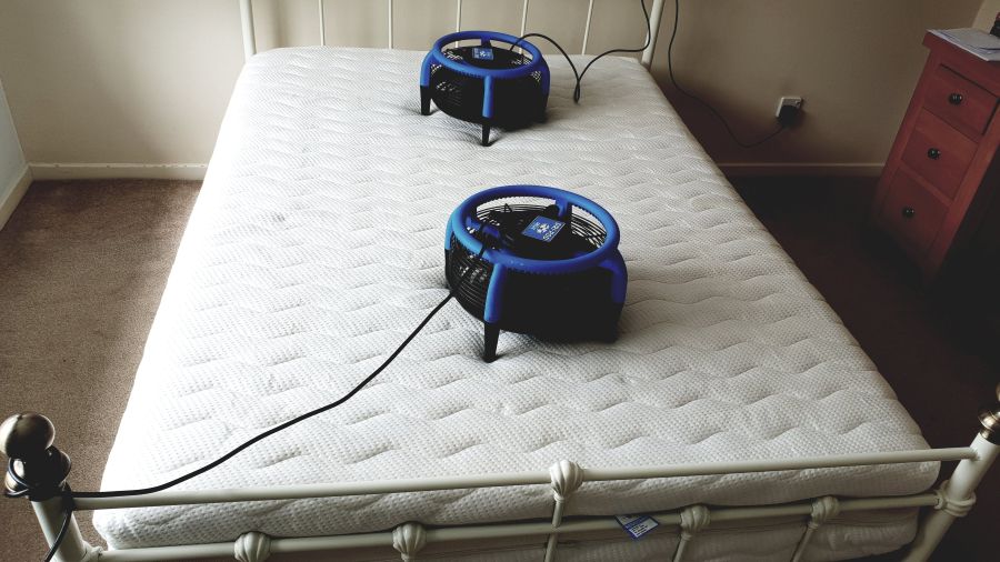 Professional mattress cleaning in Ely by Ely Cleaning Services using two Dri-Pod air movers for rapid drying after deep steam extraction.